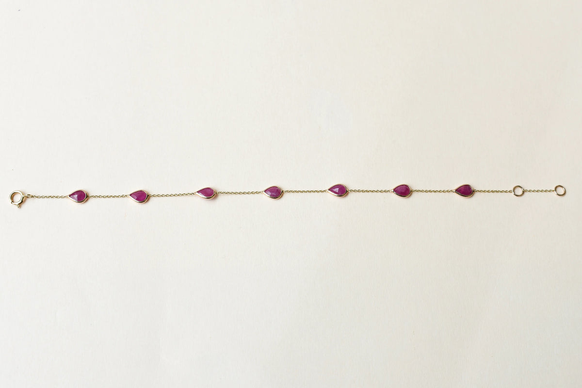 10K gold bracelet with pear-cut ruby drops