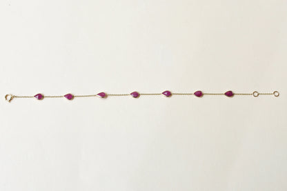 10K gold bracelet with pear-cut ruby drops