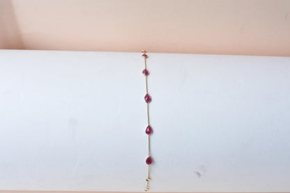 10K gold bracelet with pear-cut ruby drops