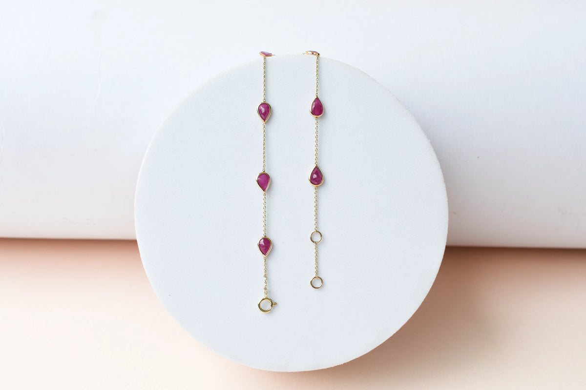 10K gold bracelet with pear-cut ruby drops