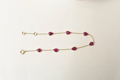 10K gold bracelet with pear-cut ruby drops