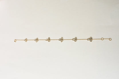 18K gold bracelet with clover-shaped clusters of polki diamond slices