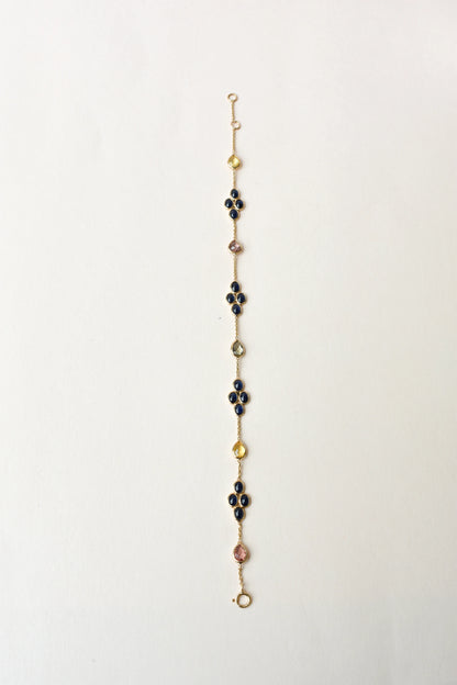 18K gold bracelet with blue sapphire clusters and multi-color sapphire accents