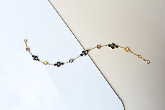 18K gold bracelet with blue sapphire clusters and multi-color sapphire accents