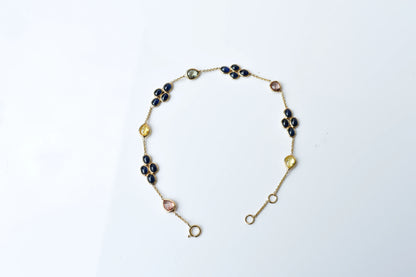 18K gold bracelet with blue sapphire clusters and multi-color sapphire accents