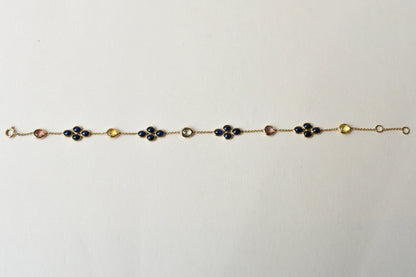 18K gold bracelet with blue sapphire clusters and multi-color sapphire accents