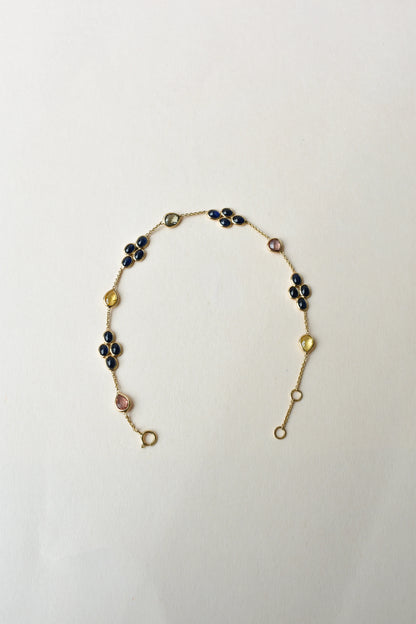 18K gold bracelet with blue sapphire clusters and multi-color sapphire accents