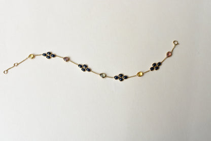 18K gold bracelet with blue sapphire clusters and multi-color sapphire accents