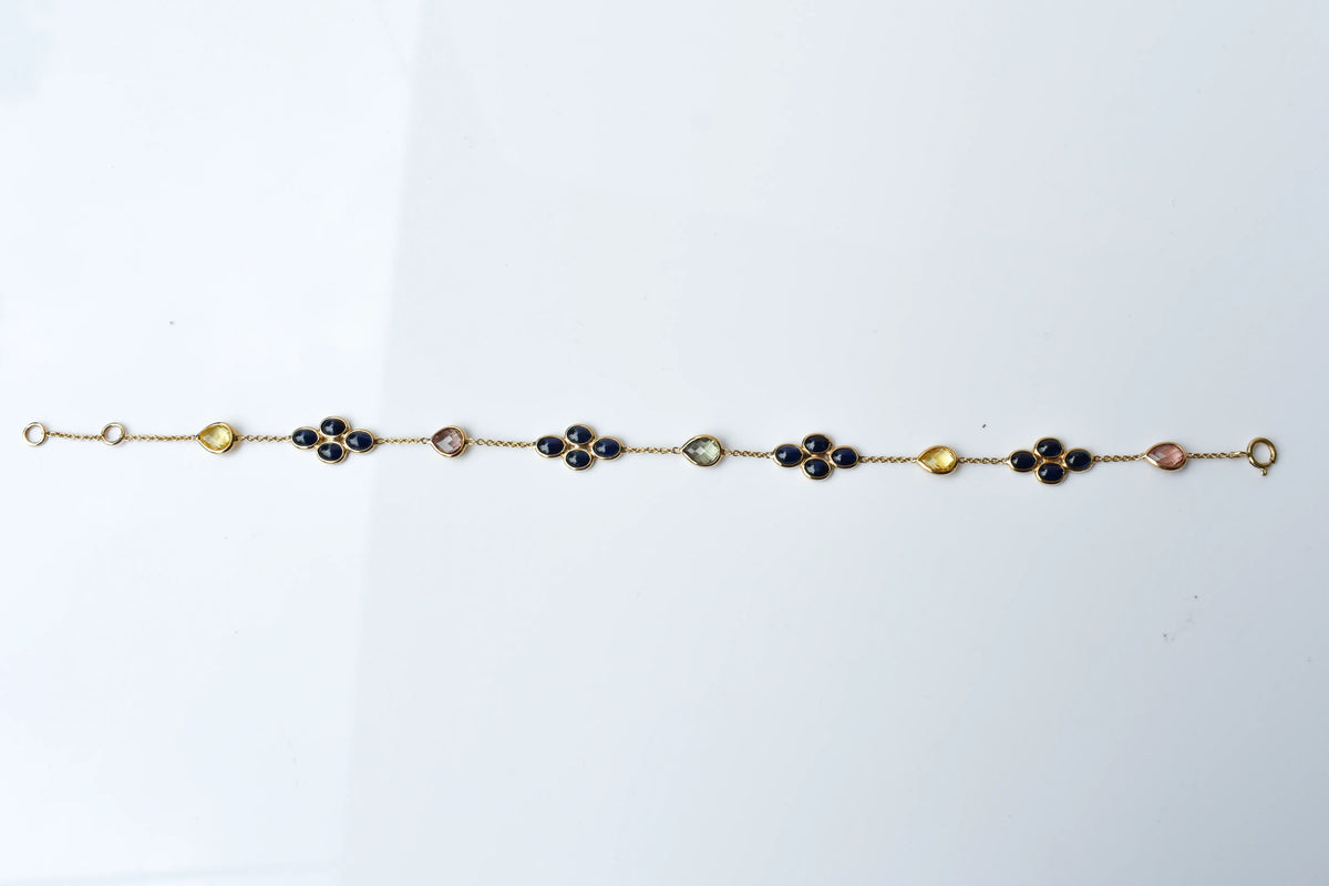 18K gold bracelet with blue sapphire clusters and multi-color sapphire accents