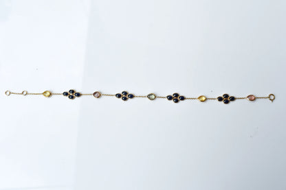 18K gold bracelet with blue sapphire clusters and multi-color sapphire accents