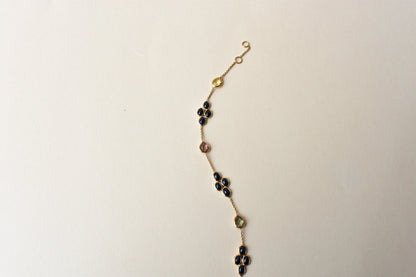 18K gold bracelet with blue sapphire clusters and multi-color sapphire accents