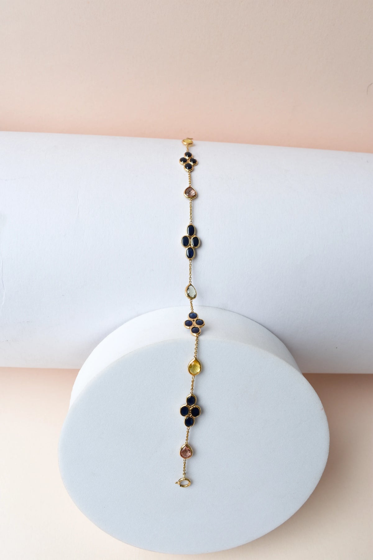 18K gold bracelet with blue sapphire clusters and multi-color sapphire accents