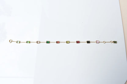 18K gold bracelet with emerald-cut pink and green tourmaline stations