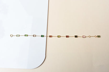 18K gold bracelet with emerald-cut pink and green tourmaline stations