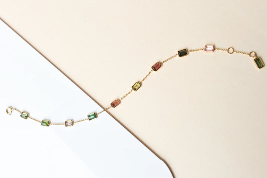 18K gold bracelet with emerald-cut pink and green tourmaline stations
