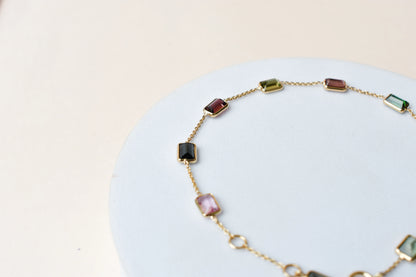 18K gold bracelet with emerald-cut pink and green tourmaline stations