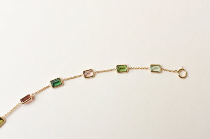 18K gold bracelet with emerald-cut pink and green tourmaline stations