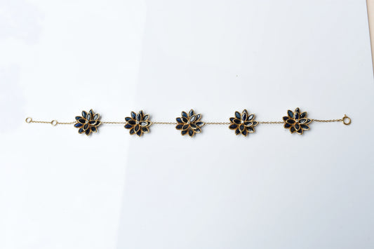 18K gold bracelet with blue sapphire flower clusters and diamond centers
