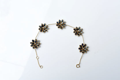 18K gold bracelet with blue sapphire flower clusters and diamond centers