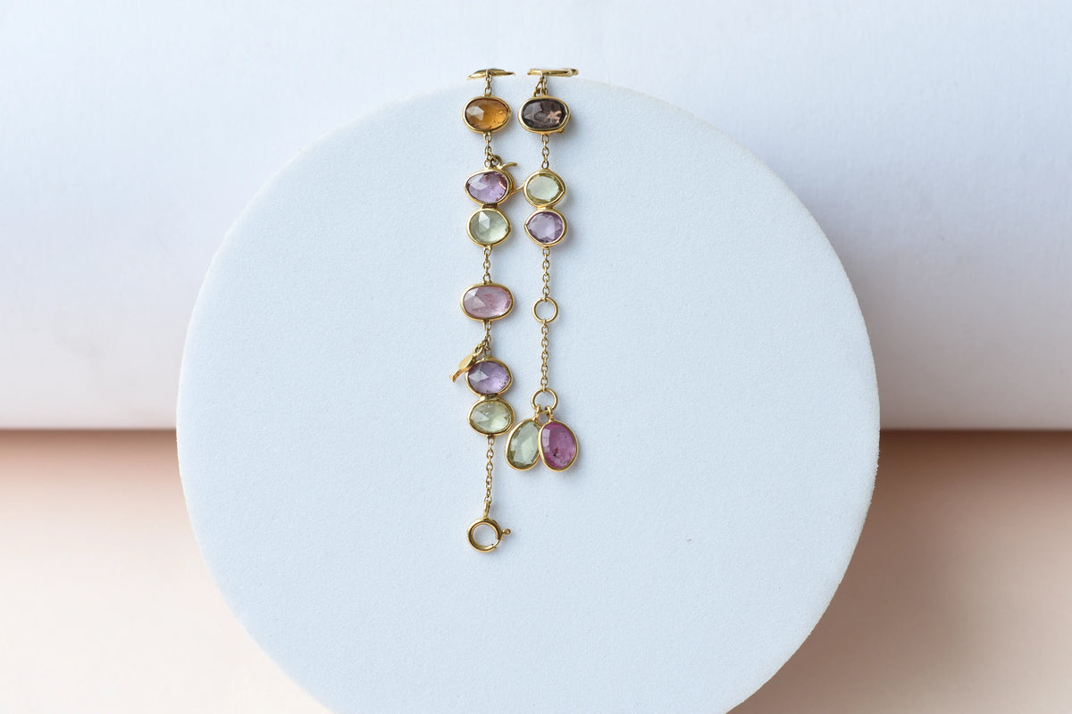 18K gold bracelet with a cluster of violet, green and pink sapphires