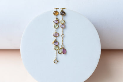 18K gold bracelet with a cluster of violet, green and pink sapphires
