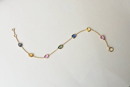 18K gold bracelet with single oval multi-color sapphire stations
