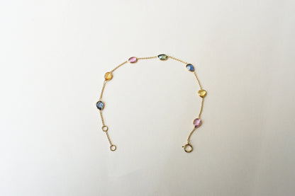 18K gold bracelet with single oval multi-color sapphire stations