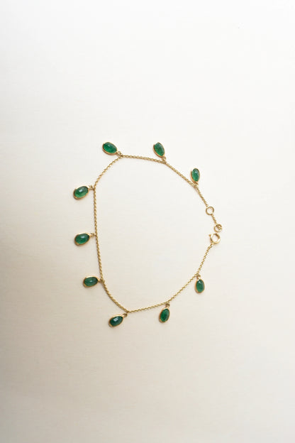 18K gold bracelet with oval emerald drops in fringe design