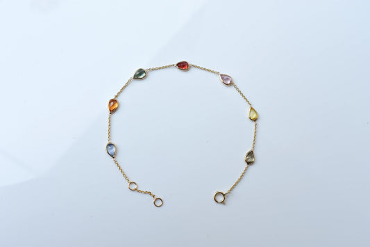 18K gold bracelet with pear-cut multi-color sapphire stations
