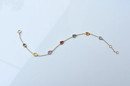 18K gold bracelet with pear-cut multi-color sapphire stations