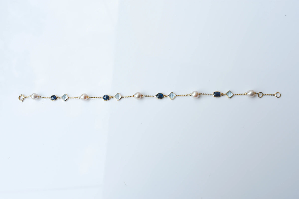 14K gold bracelet with pearls, blue sapphire and aquamarine stations