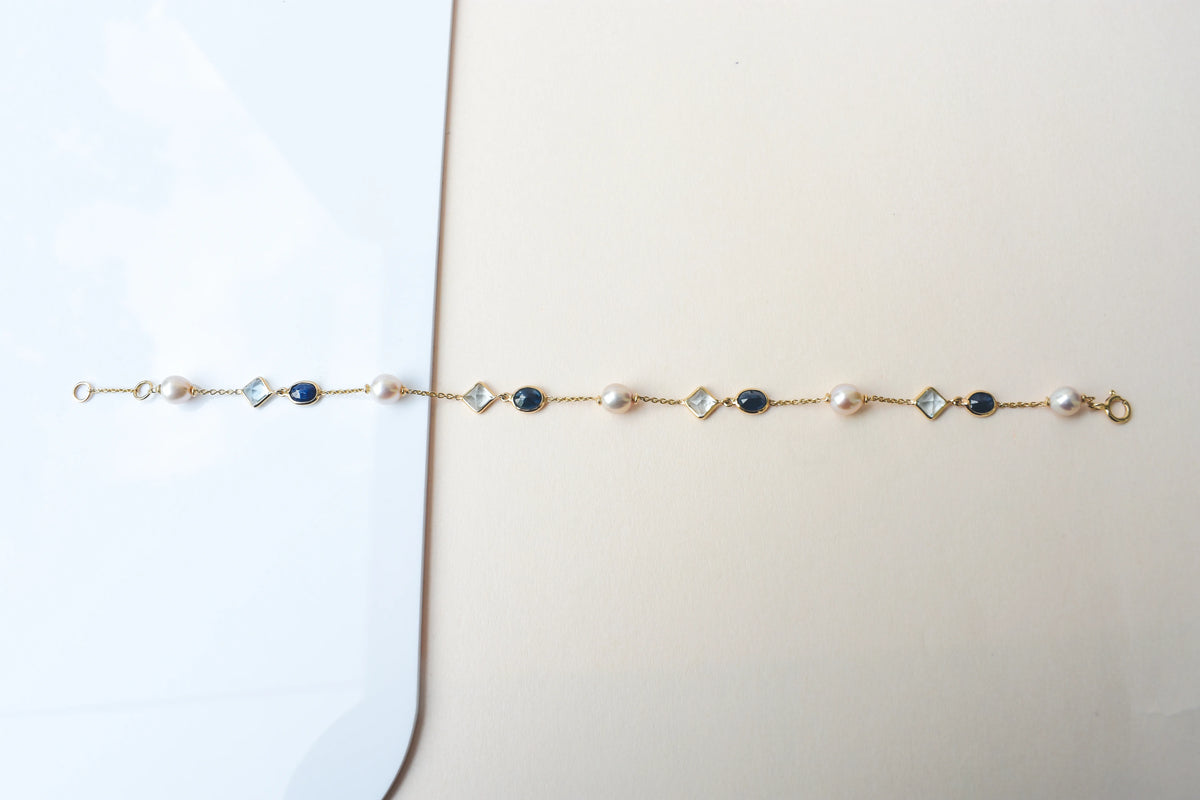 14K gold bracelet with pearls, blue sapphire and aquamarine stations