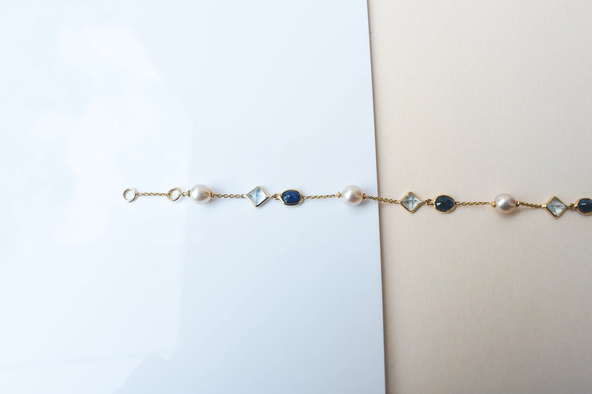 14K gold bracelet with pearls, blue sapphire and aquamarine stations