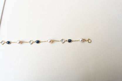 14K gold bracelet with pearls, blue sapphire and aquamarine stations