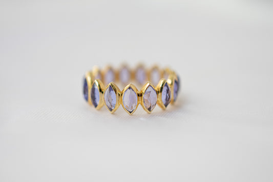 Marquise-cut tanzanite gemstone eternity ring in 14K gold with bezel setting