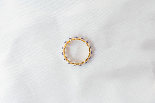 Marquise-cut tanzanite gemstone eternity ring in 14K gold with bezel setting