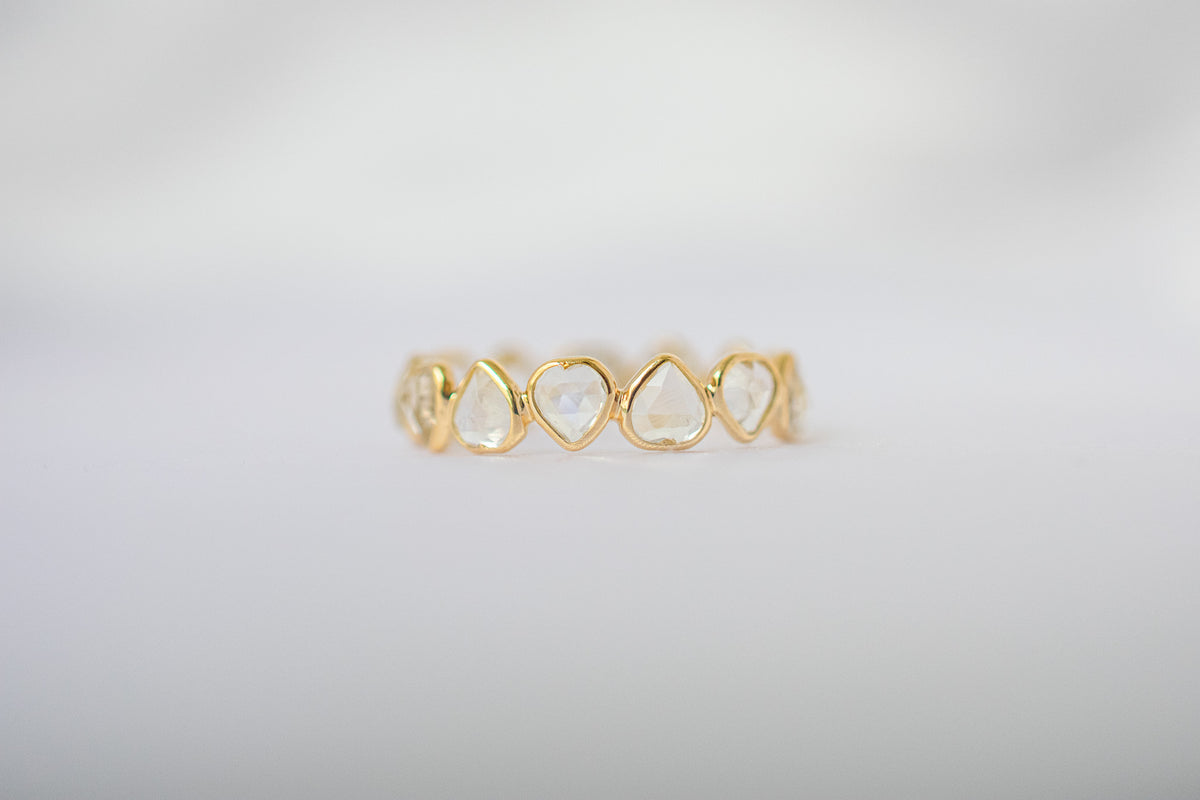 Heart-cut rainbow moonstone gemstone eternity ring in 18K gold with bezel setting