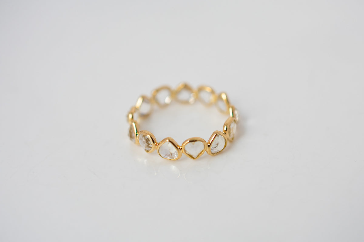 Heart-cut rainbow moonstone gemstone eternity ring in 18K gold with bezel setting