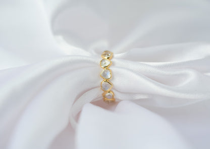 Heart-cut rainbow moonstone gemstone eternity ring in 18K gold with bezel setting