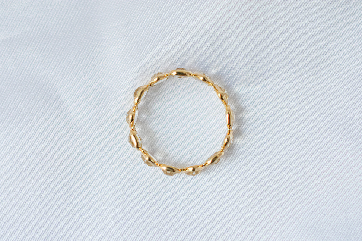 Heart-cut rainbow moonstone gemstone eternity ring in 18K gold with bezel setting