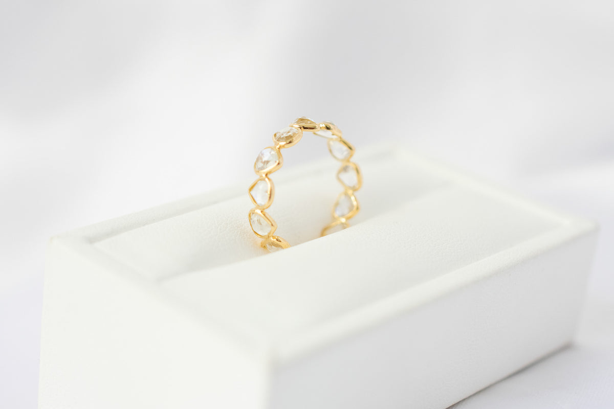 Heart-cut rainbow moonstone gemstone eternity ring in 18K gold with bezel setting