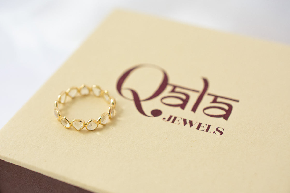 Heart-cut rainbow moonstone gemstone eternity ring in 18K gold with bezel setting