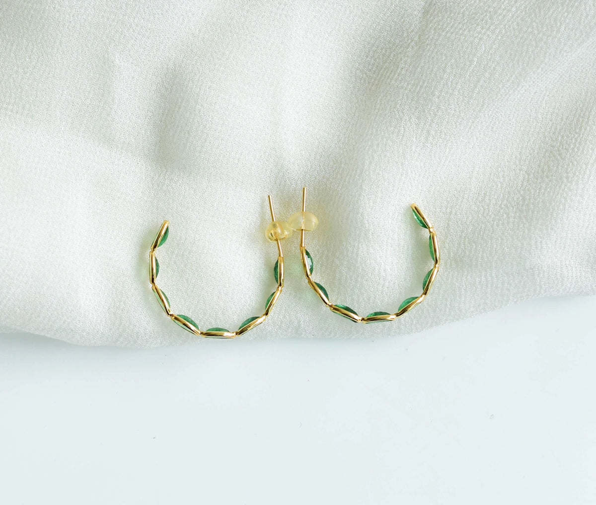 18K gold hoop earrings with marquise-cut emeralds