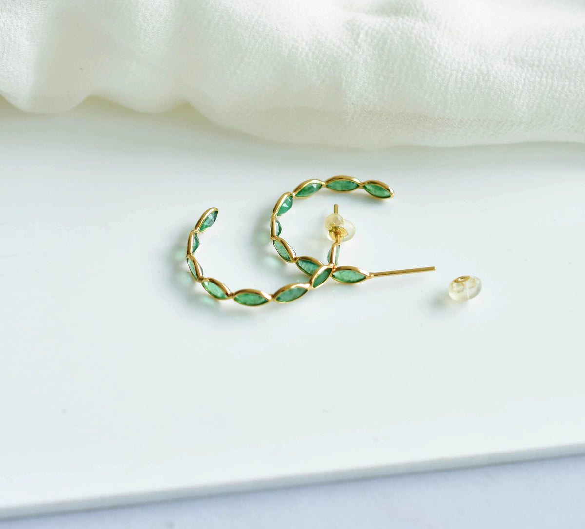 18K gold hoop earrings with marquise-cut emeralds