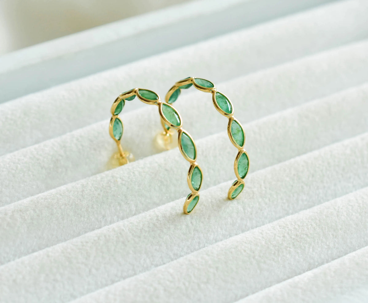 18K gold hoop earrings with marquise-cut emeralds