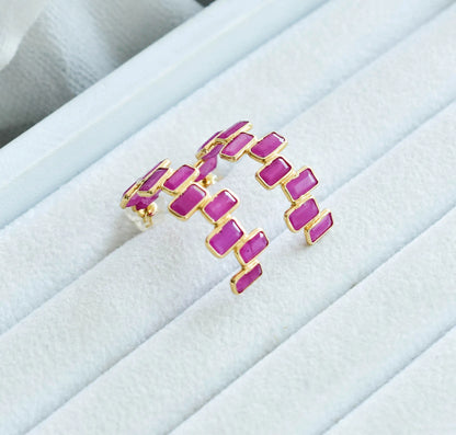 18K gold ear climbers with staggered baguette-cut rubies