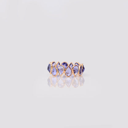 18K gold eternity ring with bezel-set pear-cut tanzanite stones