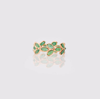 18K gold eternity ring with marquise-cut emeralds in a floral vine design