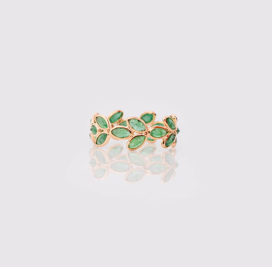 18K gold eternity ring with marquise-cut emeralds in a floral vine design