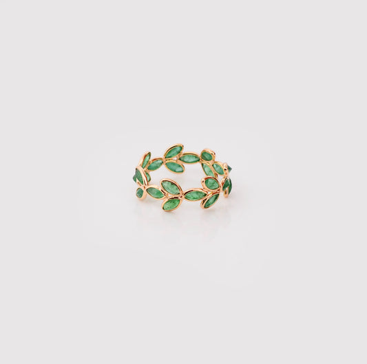 18K gold eternity ring with marquise-cut emeralds in a floral vine design